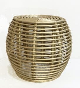Rattan stool with gold leafing on the stool.