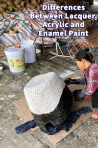 A woman paint a seagrass basket