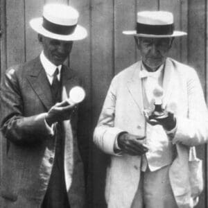 Thomas Edison Right And Henry Ford Examining The Lightbulbs