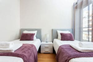 Two Twin Mattress In Guest Room